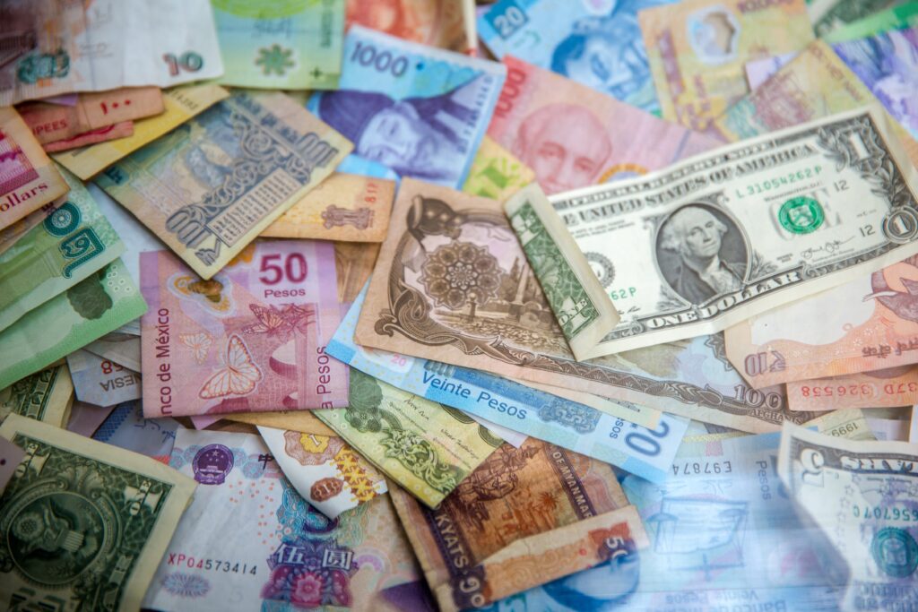 Different currencies representing financial reparation towards study abroad