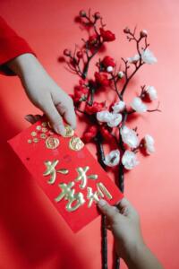 Giving red envelope during the Chinese New Year is a symbolic gesture for the season