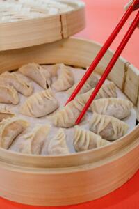 Internstional students studying in China try dumpling as part of their cultural immersion 