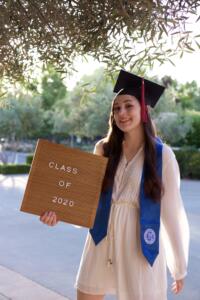 Excelling academically brings smiles on the face of the student. This picture shows a happy graduating student