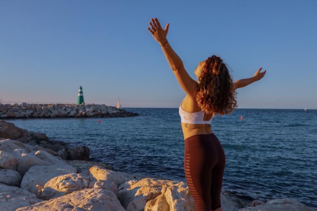 The picture shows a student exercising to ease off stress for online learning. 