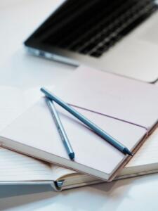 A student takes notes for his research paper