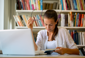 A student studying hard to write her literature review